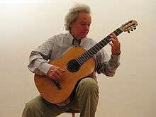 Carlo Domeniconi, with a Luigi Mozzani guitar from 1938